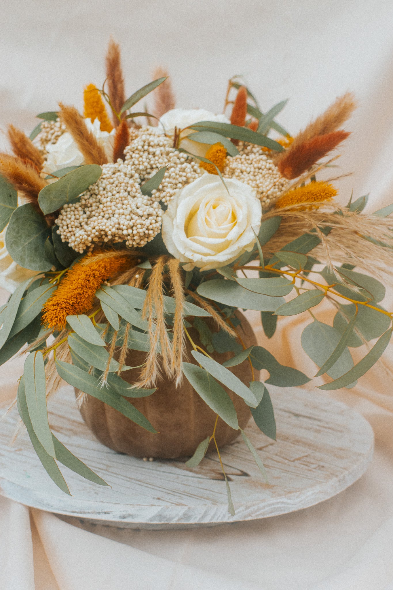 "Café Latte" flower arrangement in a pumpkin vase