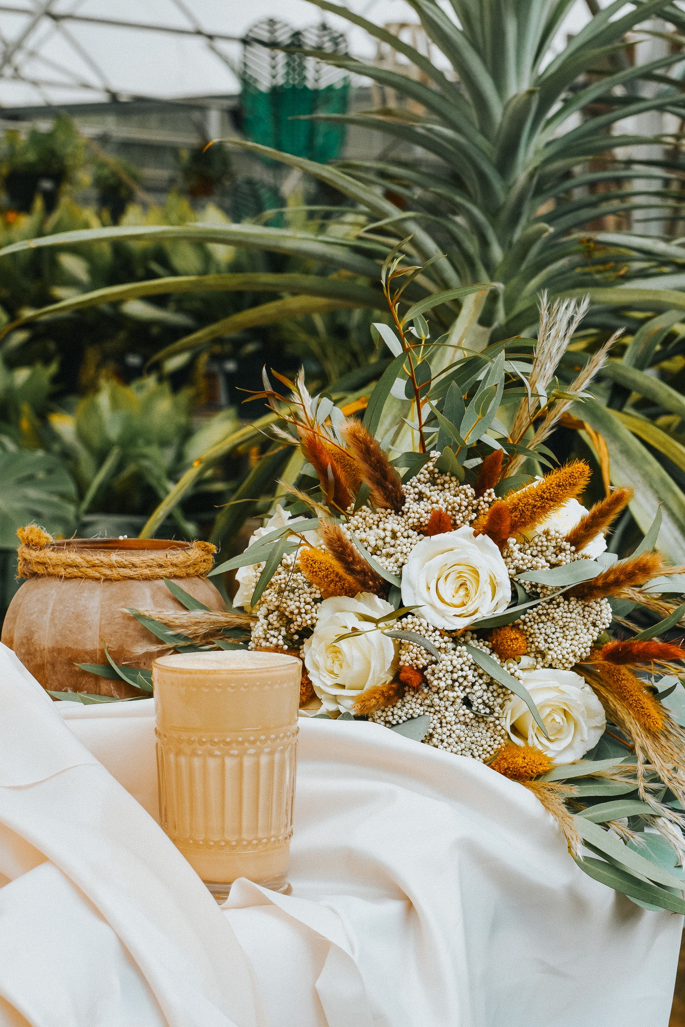 "Café Latte" flower arrangement in a pumpkin vase