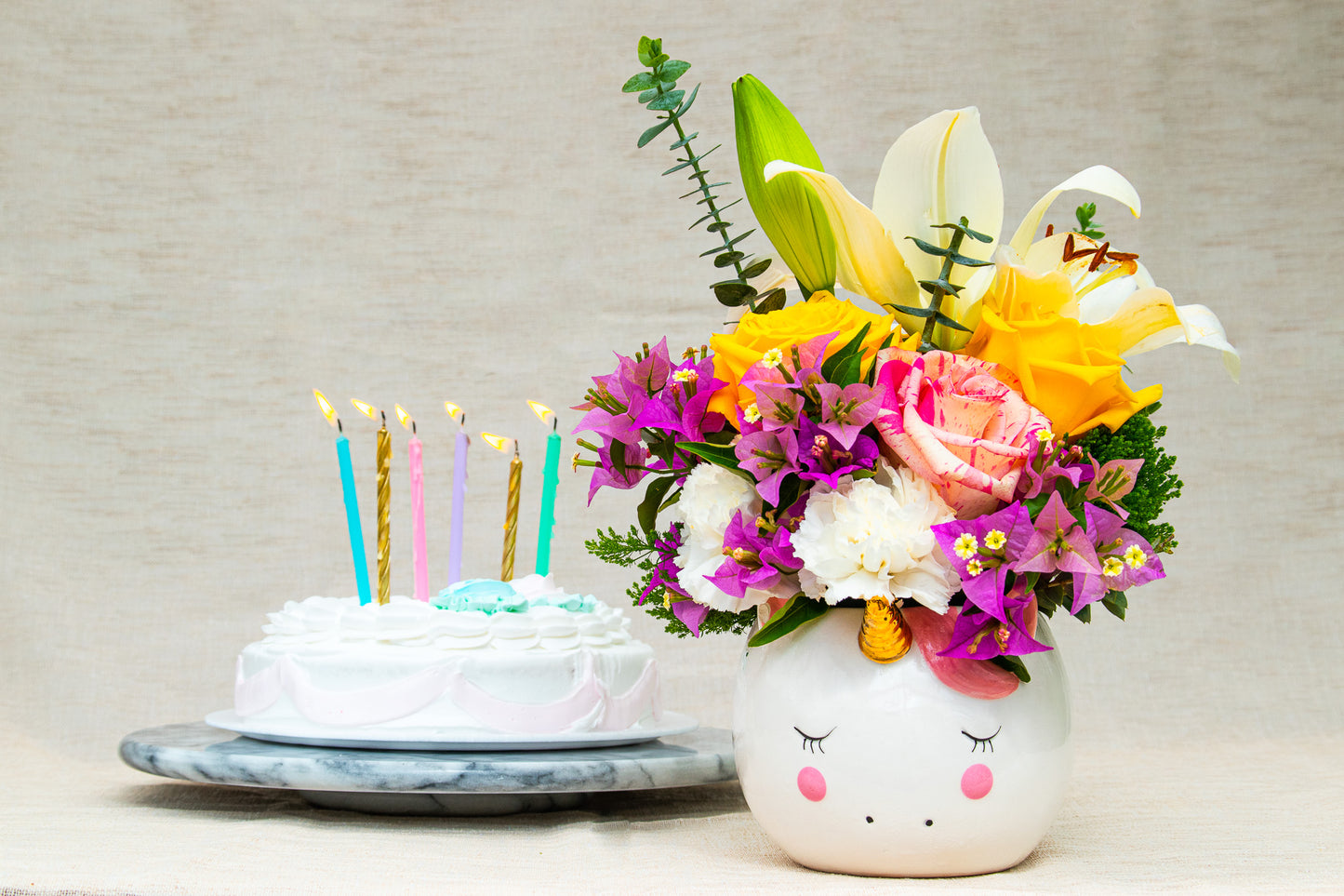 "Magical"  flower arrangement in the unicorn pot