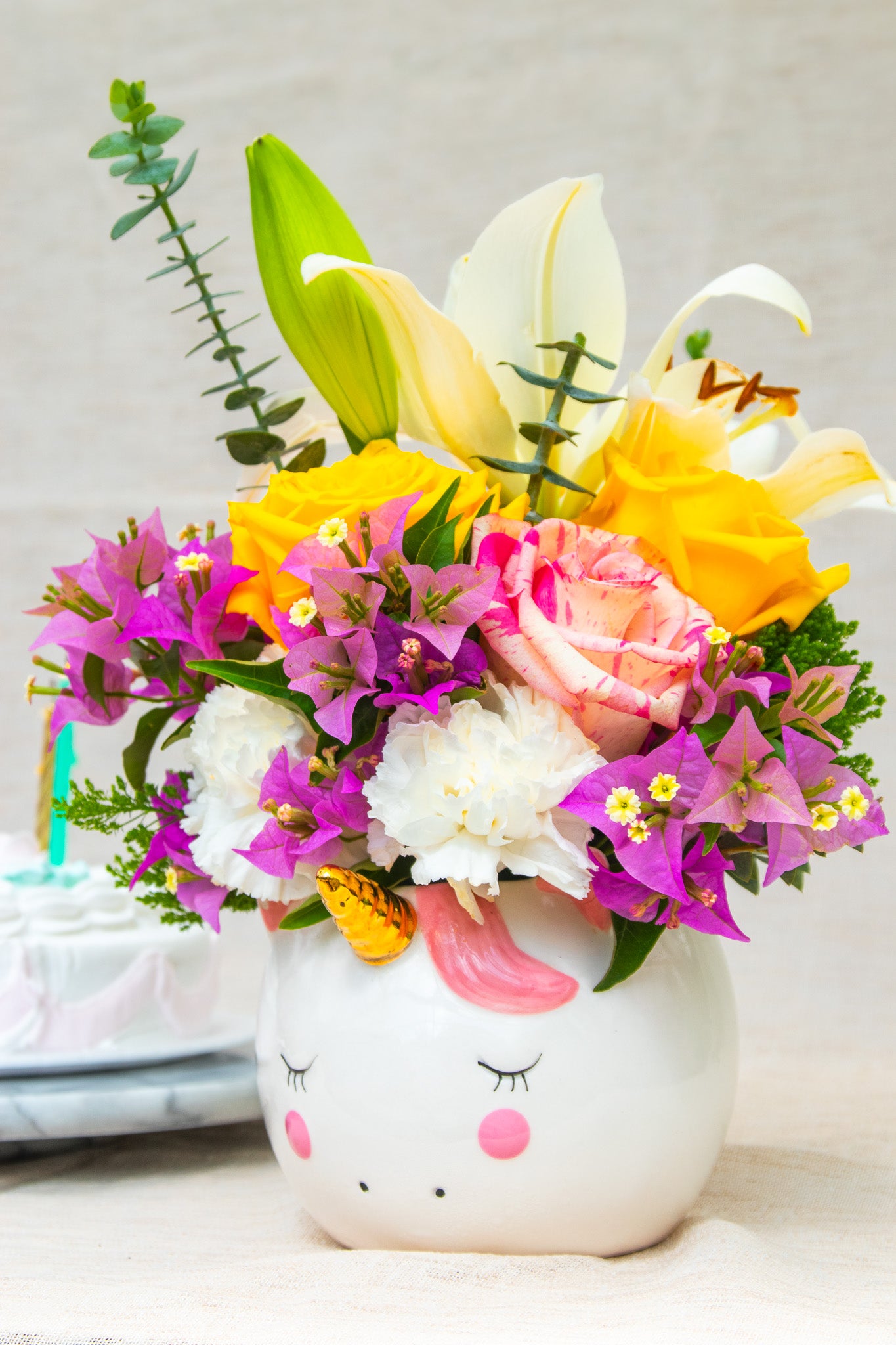 "Magical"  flower arrangement in the unicorn pot