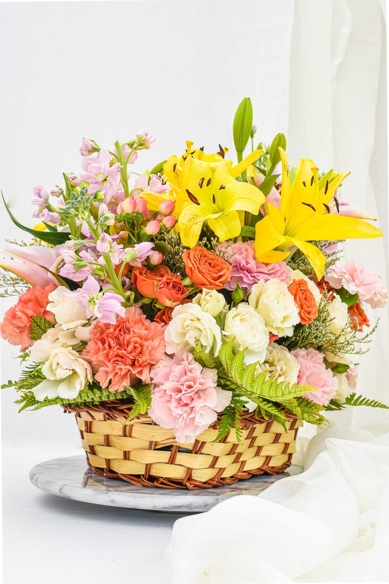 "Country garden" flower arrangement in the wicker basket