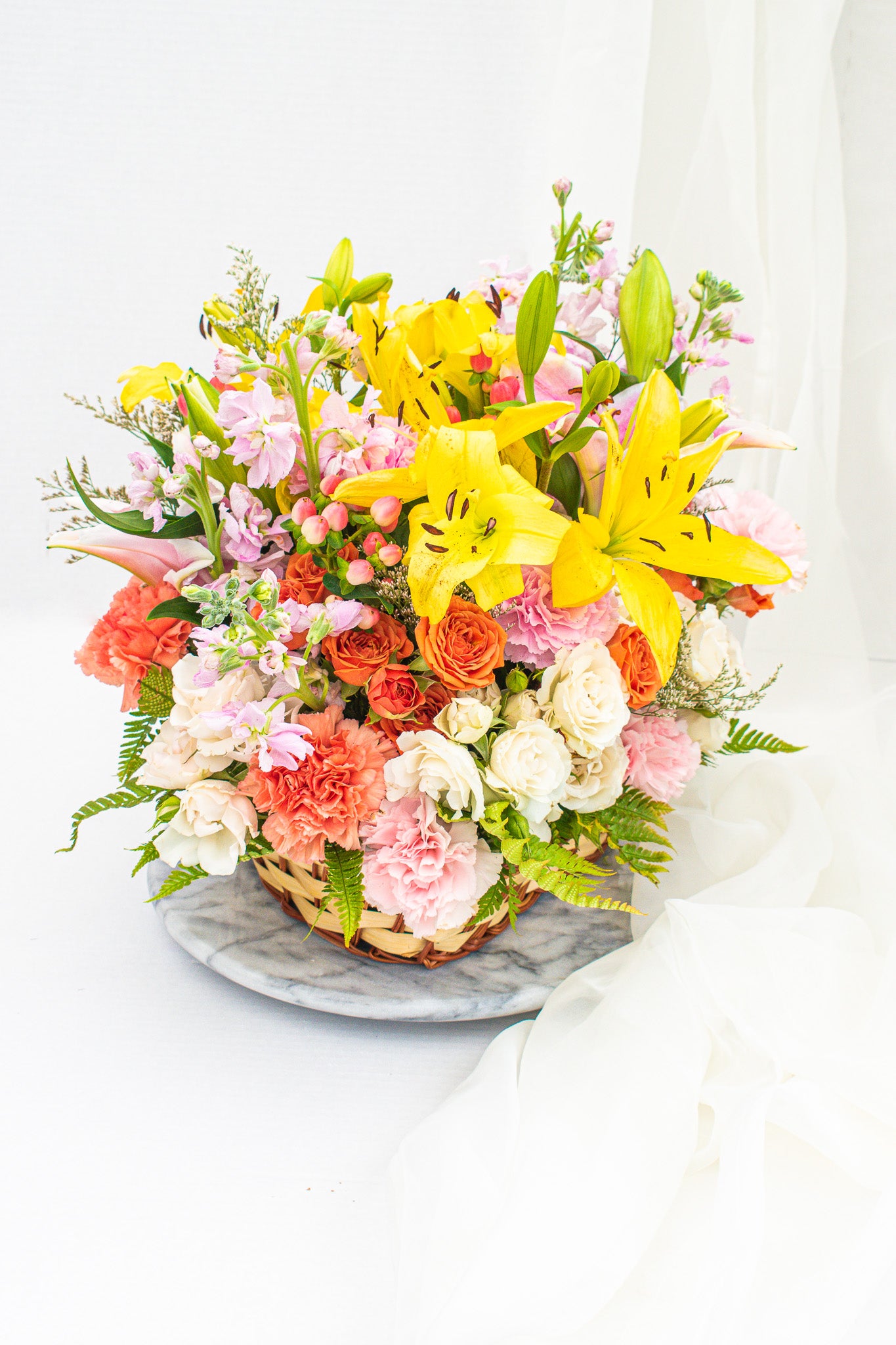 "Country garden" flower arrangement in the wicker basket