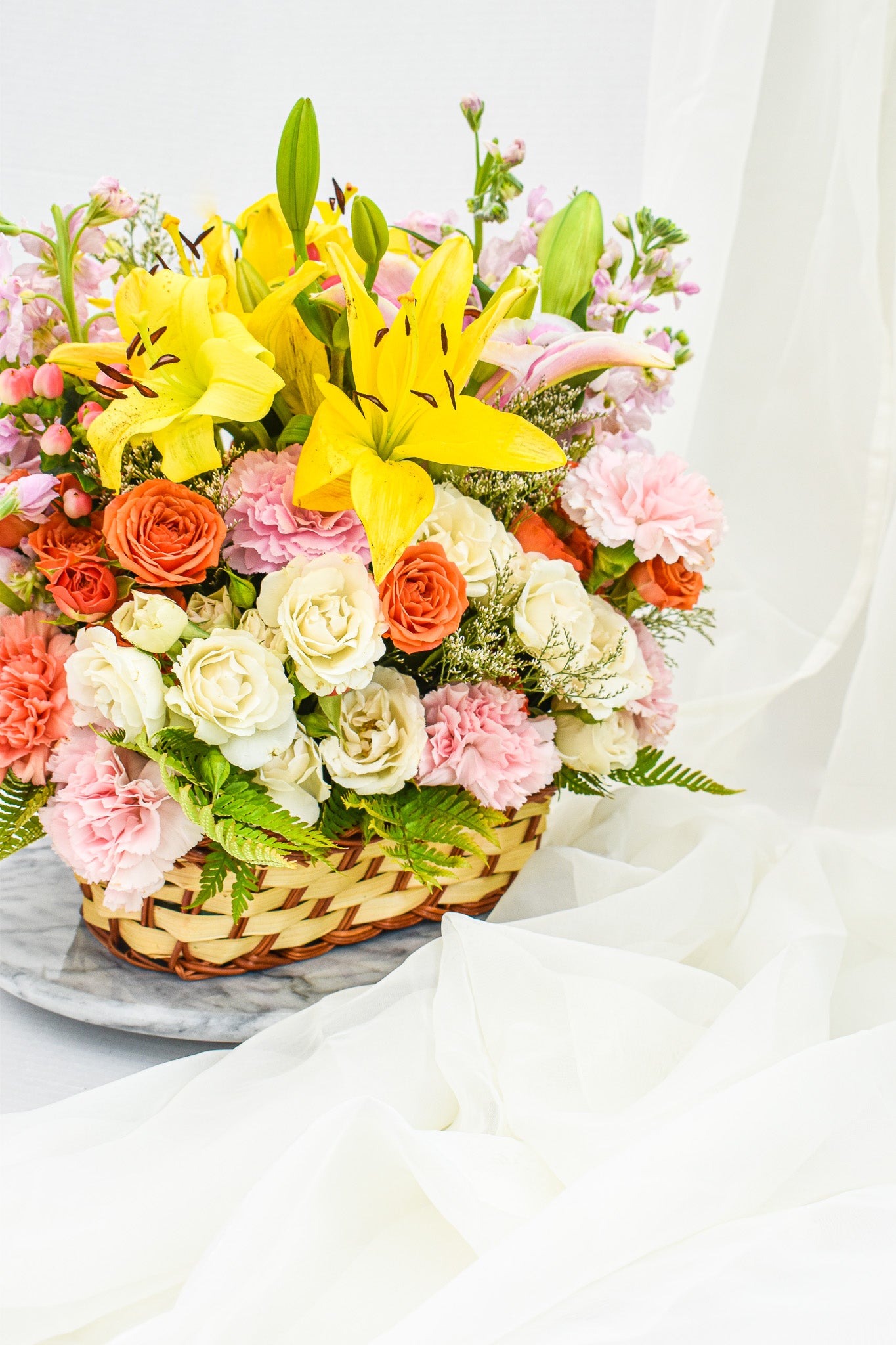 "Country garden" flower arrangement in the wicker basket